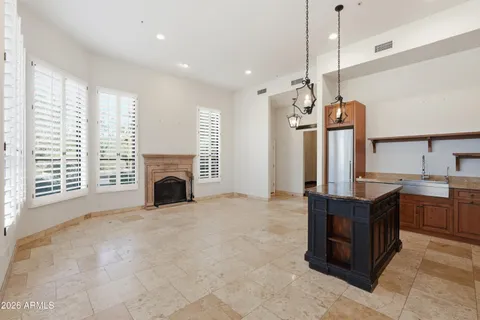 a bathroom with a granite countertop sink a shower and a mirror
