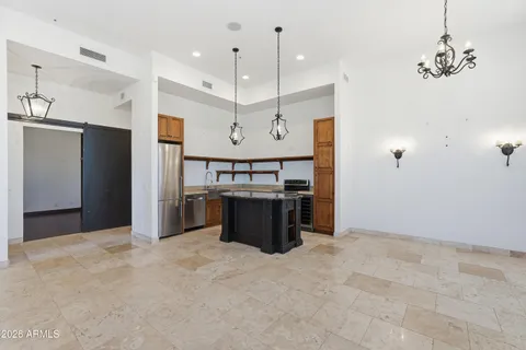 a view of kitchen and stove top oven