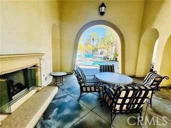 a view of a swimming pool and trees in the background