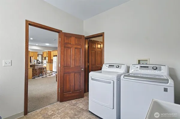 a utility room with dryer and washer