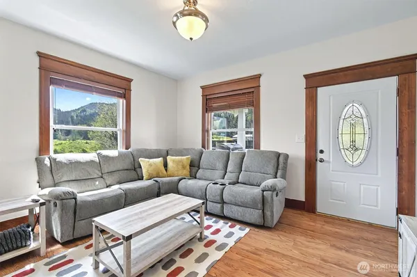 a living room with furniture and a window