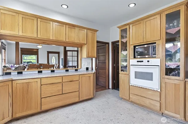 a kitchen with stainless steel appliances a stove a refrigerator and cabinets