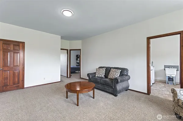a living room with furniture and a area