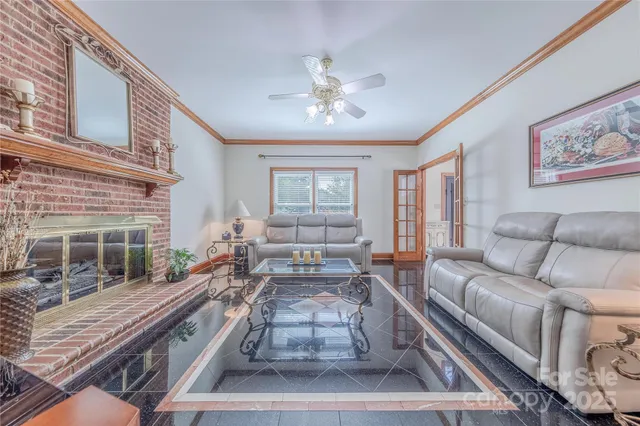 a living room with furniture and windows
