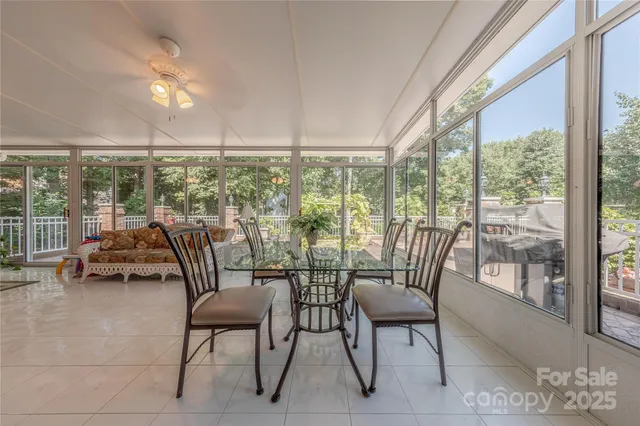 a view of a city from a dining room with furniture water view and mountain view