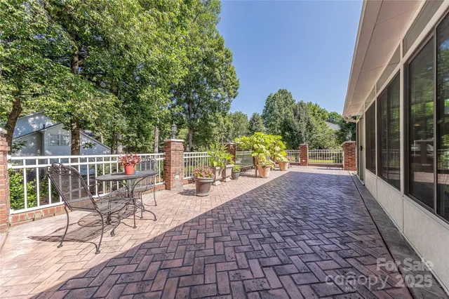 a view of a chairs and table on the patio