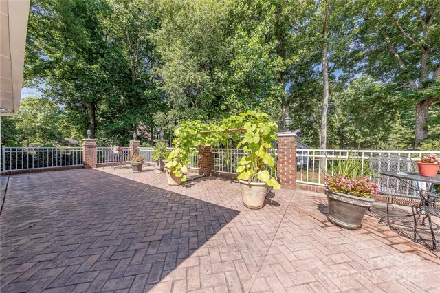 a view of a chairs and tables in the back yard of the house