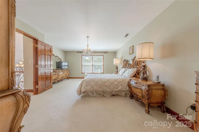 a bed room with a bed and a window