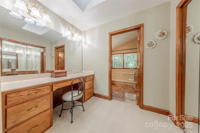 a spacious bathroom with a double vanity sink and a mirror