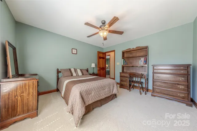 a bed room with a bed and a television