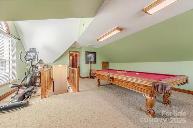 a room with gym equipment and windows