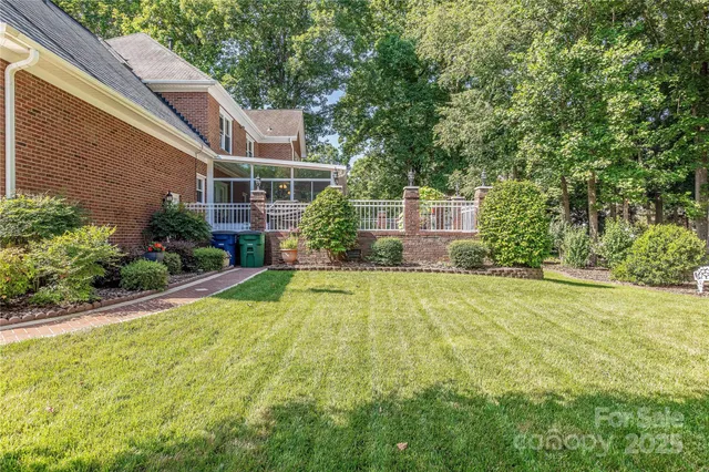 a view of a house with a yard and plants