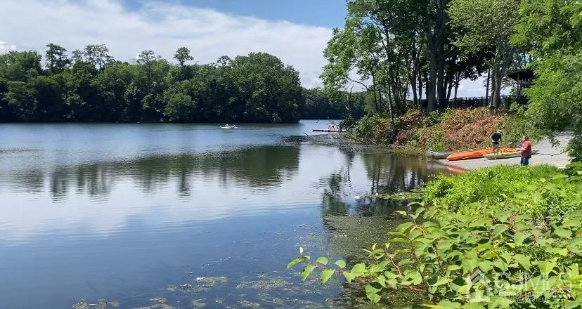 257 Matawan Avenue Matawan, NJ 07747 - Photo 24 of 28 a view of a lake with a house in the background