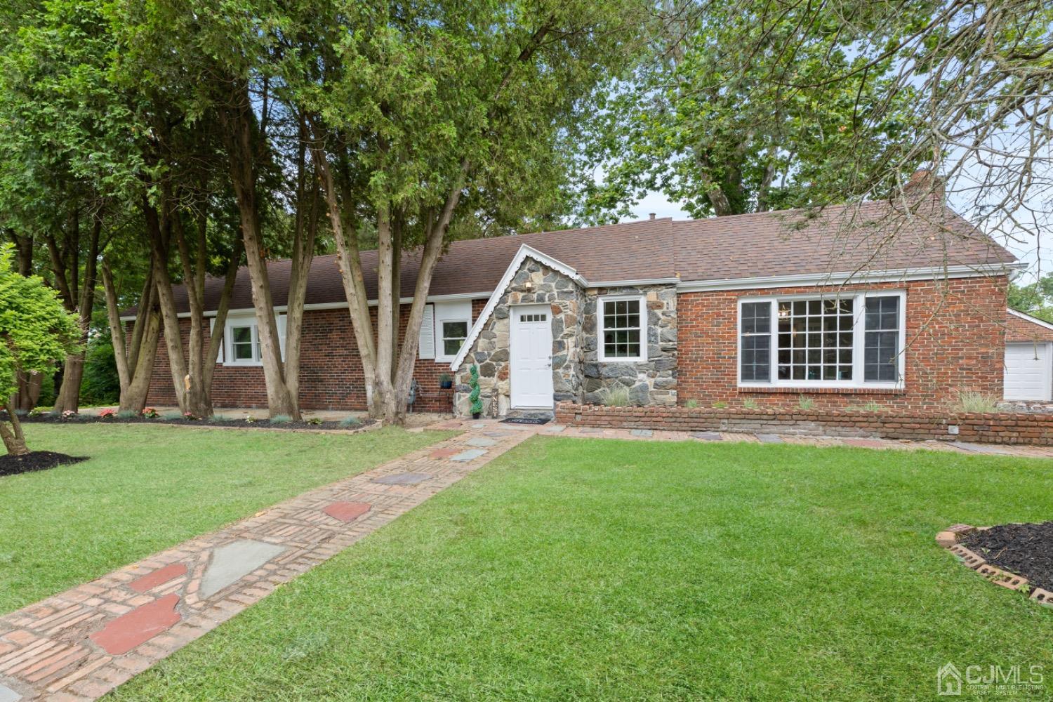 257 Matawan Avenue Matawan, NJ 07747 - Photo 5 of 28 front view of a house and a yard with trees