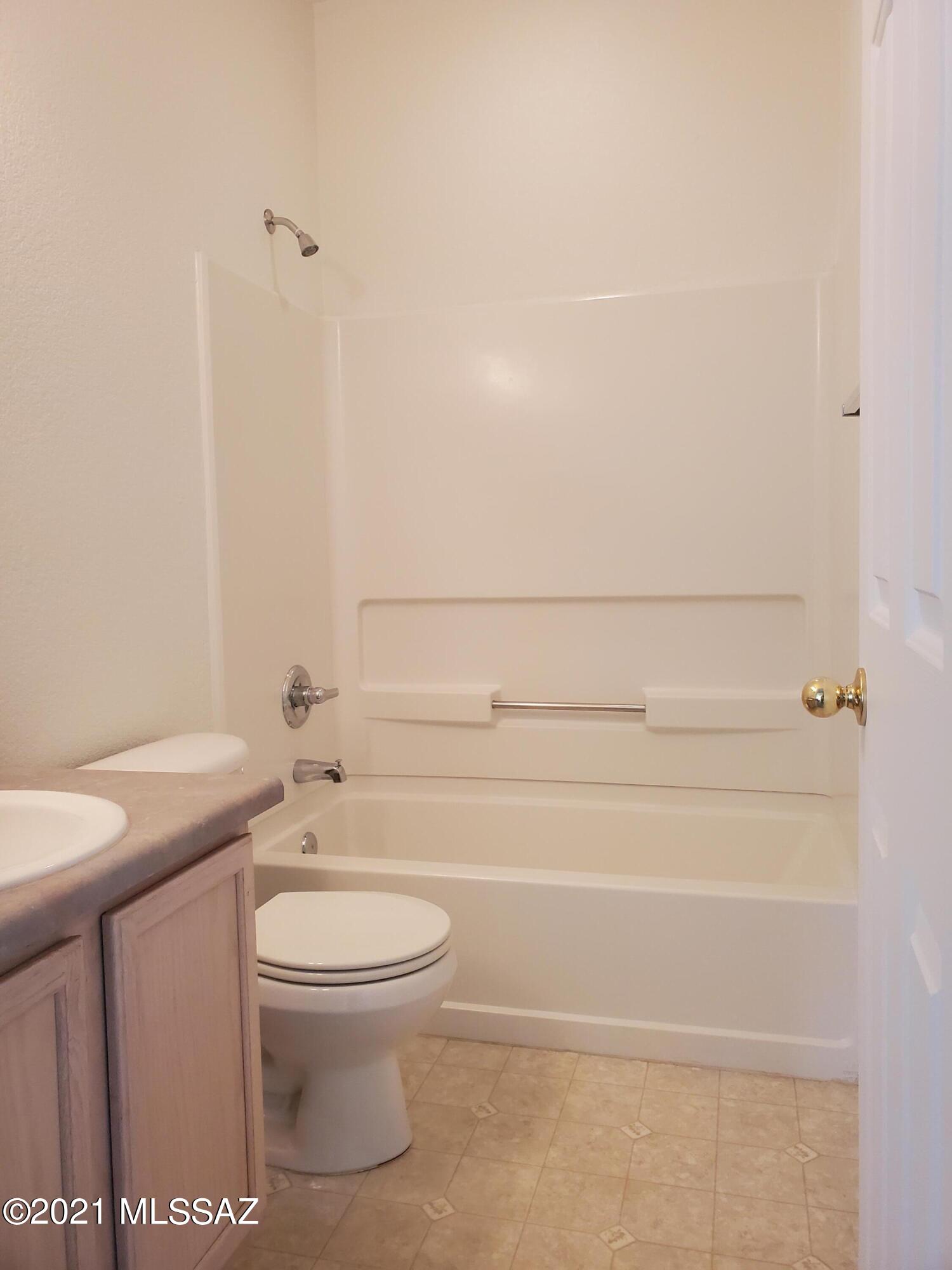3455 North Boyce Spring Lane Tucson, AZ 85745 - Photo 9 of 21 a bathroom with a toilet and a shower