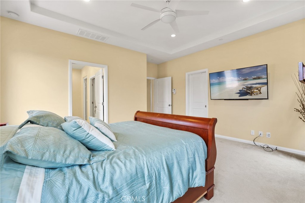 118 Chestnut Grove Irvine, CA 92620 - Photo 11 of 16 a bedroom with a bed and painting on the wall