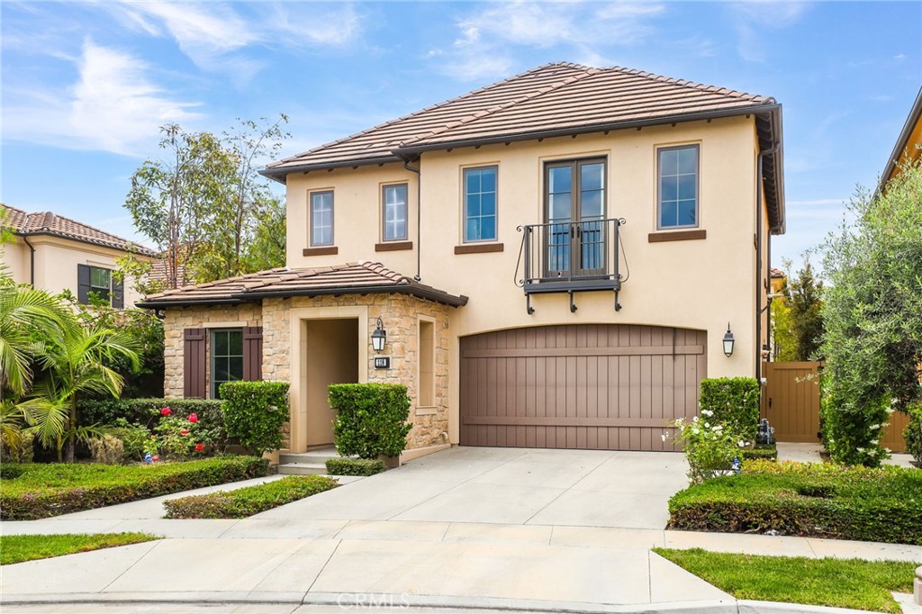 118 Chestnut Grove Irvine, CA 92620 - Photo 16 of 16 a front view of a house with a garden