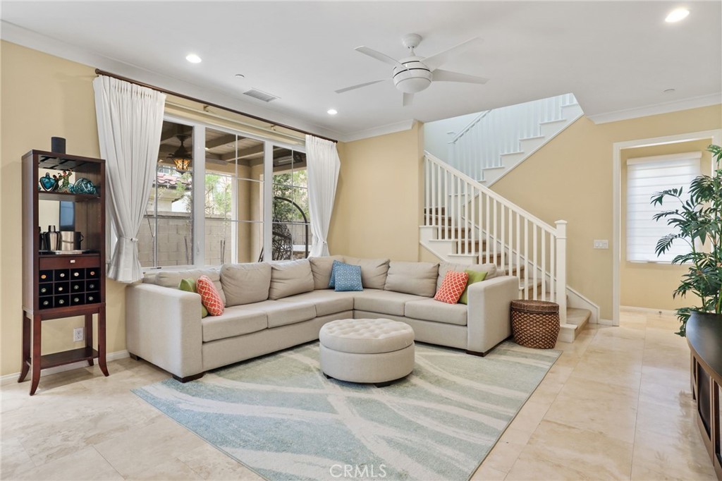 118 Chestnut Grove Irvine, CA 92620 - Photo 4 of 16 a living room with furniture and a large window