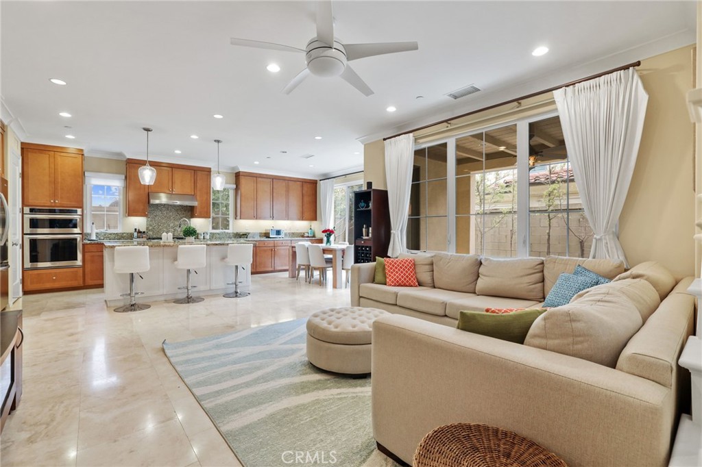 118 Chestnut Grove Irvine, CA 92620 - Photo 5 of 16 a living room with furniture and kitchen view