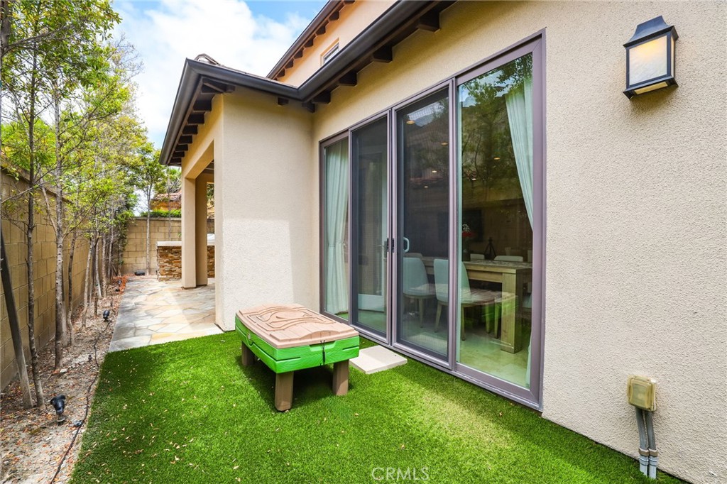 118 Chestnut Grove Irvine, CA 92620 - Photo 7 of 16 a backyard of a house with yard and outdoor seating