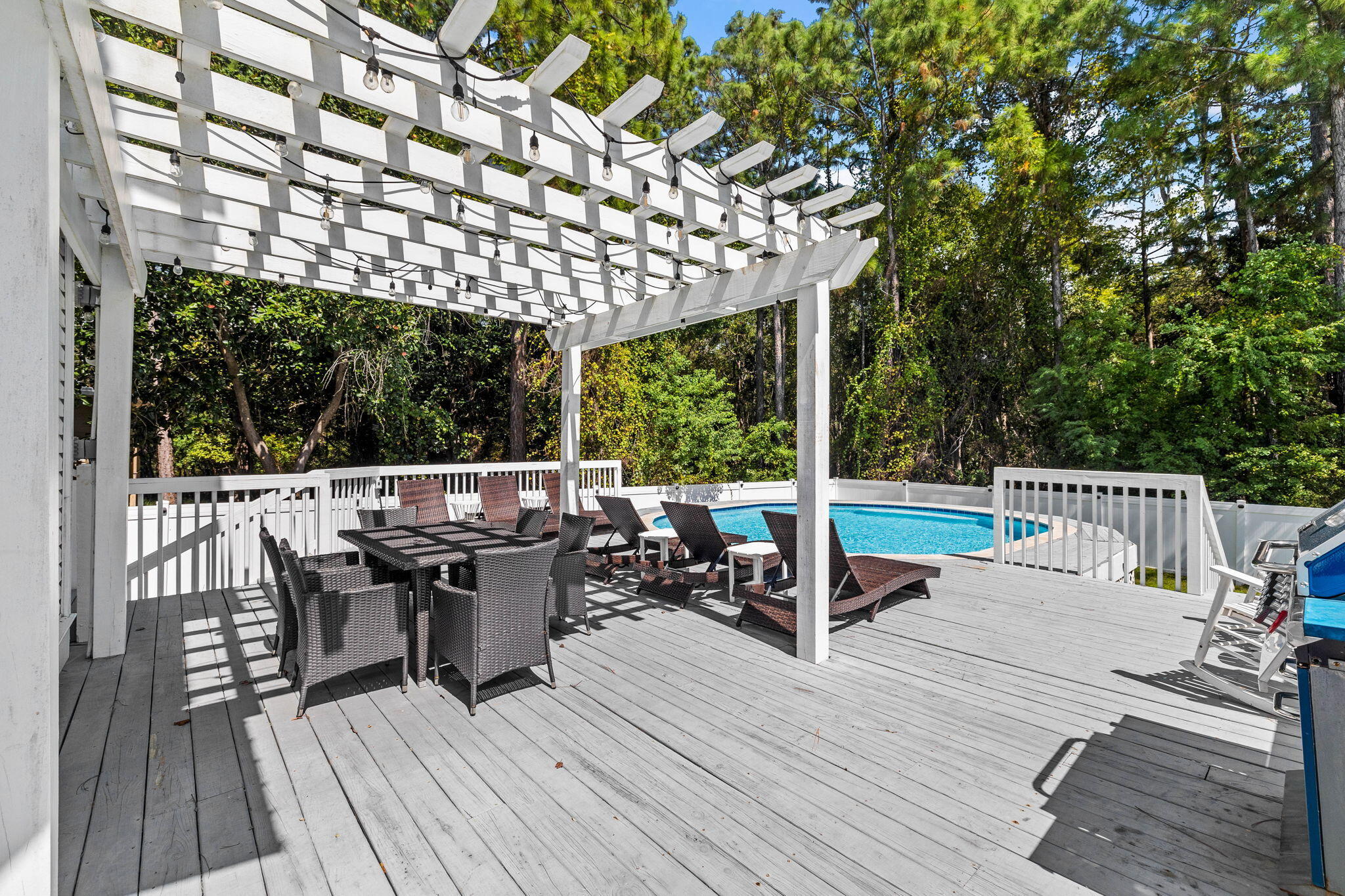 429 Montigo Avenue Santa Rosa Beach, FL 32459 - Photo 17 of 62 a view of a chairs and table on the wooden deck