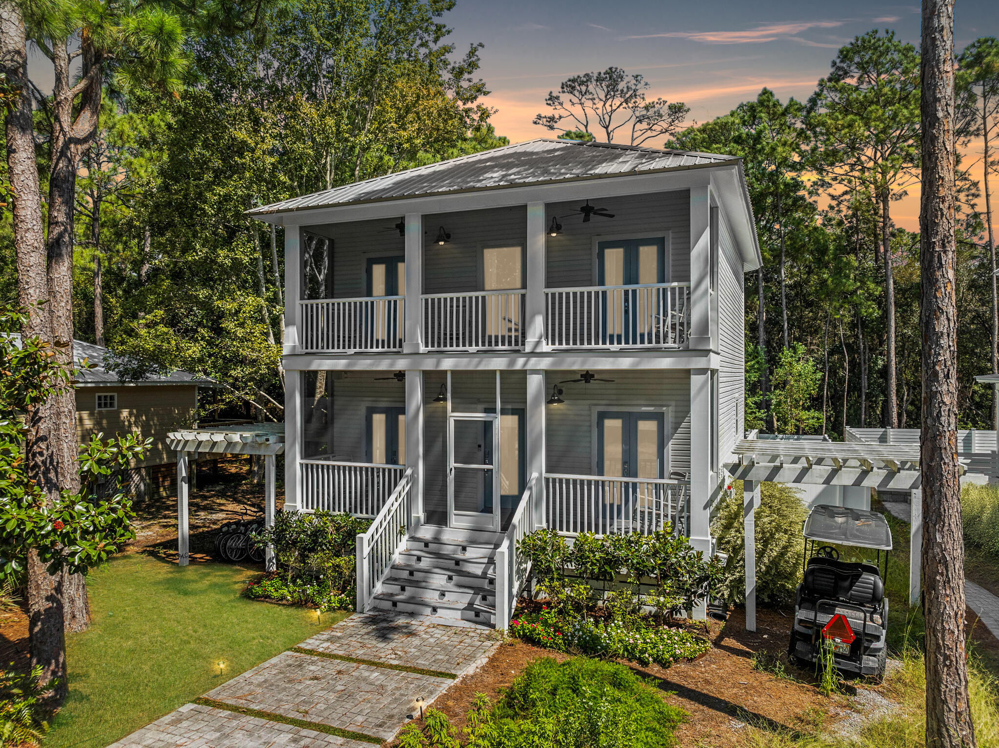 429 Montigo Avenue Santa Rosa Beach, FL 32459 - Photo 2 of 62 a front view of a house with a yard