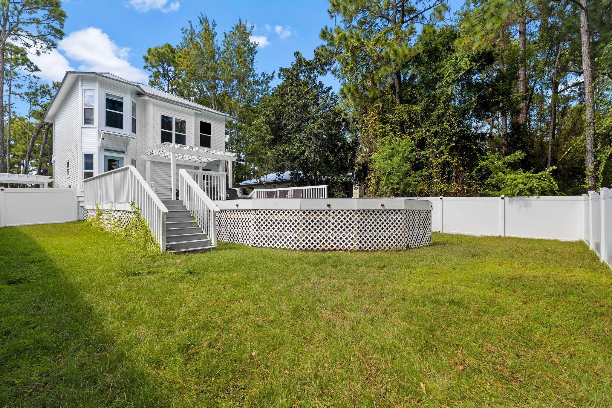 429 Montigo Avenue Santa Rosa Beach, FL 32459 - Photo 23 of 62 a view of a house with a backyard
