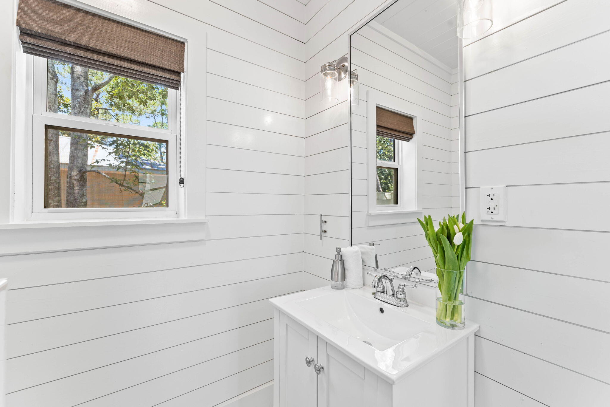 429 Montigo Avenue Santa Rosa Beach, FL 32459 - Photo 26 of 62 a bathroom with a sink and a mirror
