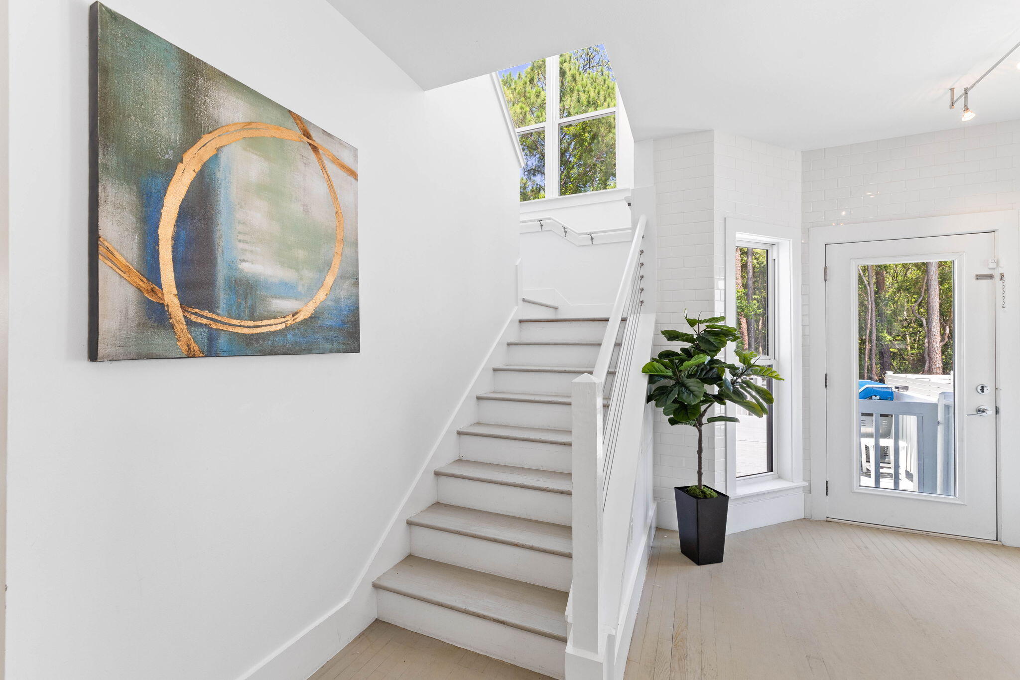 429 Montigo Avenue Santa Rosa Beach, FL 32459 - Photo 27 of 62 a view of entryway with wooden floor and a potted plant