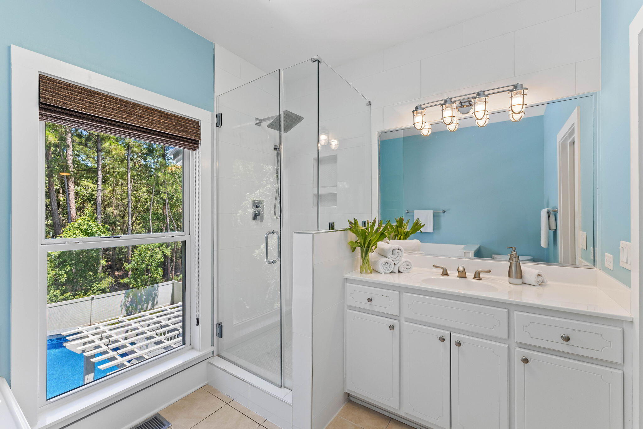429 Montigo Avenue Santa Rosa Beach, FL 32459 - Photo 32 of 62 a bathroom with a sink a large mirror and a shower