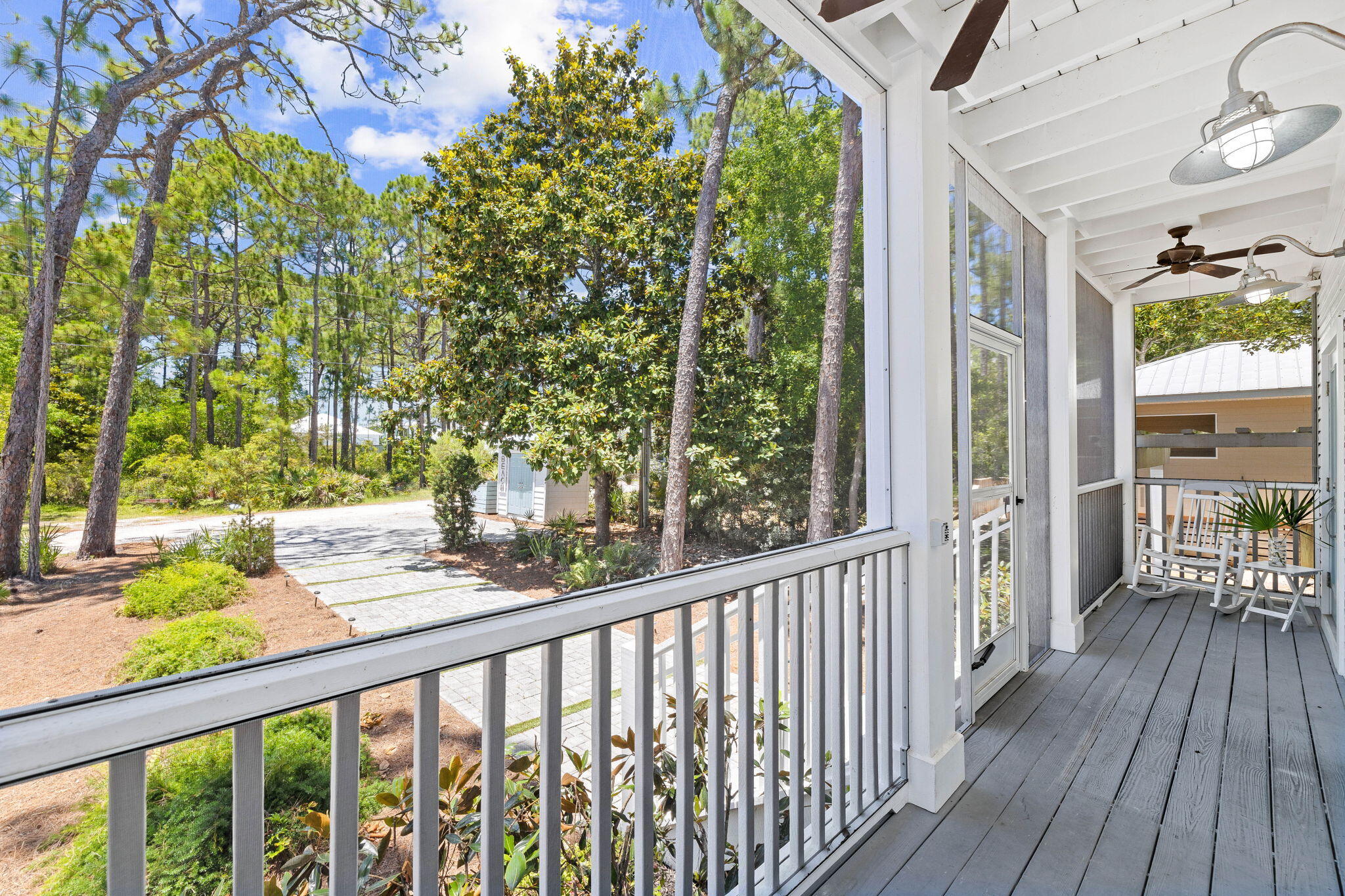 429 Montigo Avenue Santa Rosa Beach, FL 32459 - Photo 7 of 62 a view of a porch with wooden floor and outdoor seating