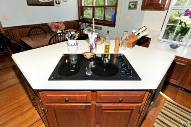 100 Springfield Drive Bangor, PA 18013 - Photo 17 of 39 a kitchen with a sink and a stove with wooden floor