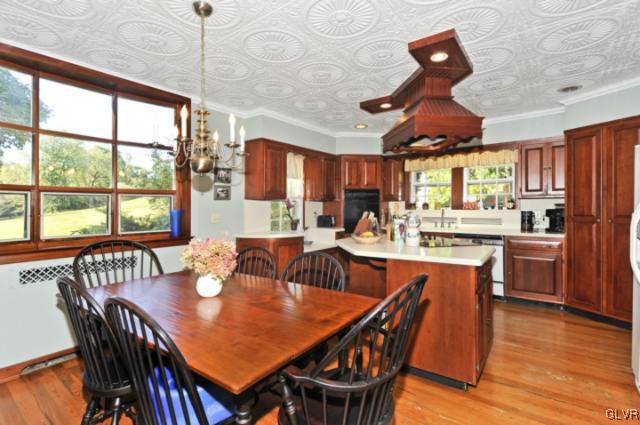 100 Springfield Drive Bangor, PA 18013 - Photo 21 of 39 a dining room with stainless steel appliances granite countertop a dining table chairs and a large window