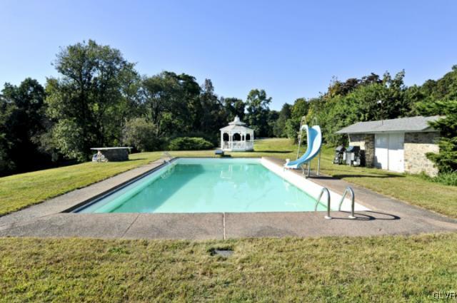 100 Springfield Drive Bangor, PA 18013 - Photo 34 of 39 a swimming pool with lots of tress in front of it
