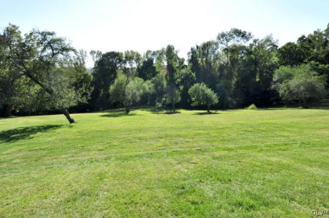 100 Springfield Drive Bangor, PA 18013 - Photo 4 of 39 a view of a field with trees in the background