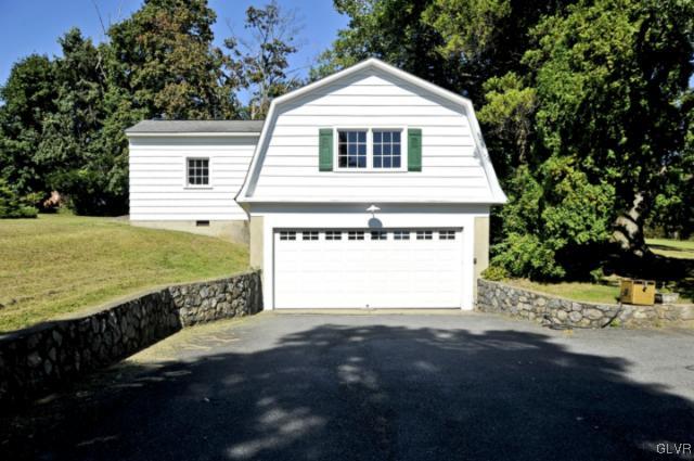 100 Springfield Drive Bangor, PA 18013 - Photo 5 of 39 a front view of a house with a yard and garage