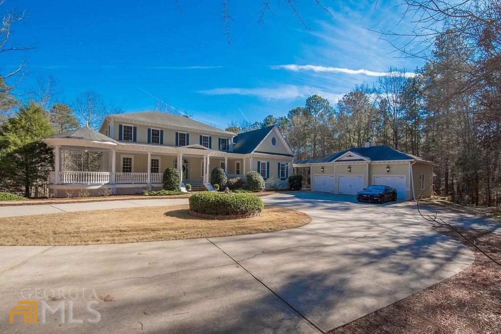 380 Quarters Road Fayetteville, GA 30215 - Photo 1 of 1 a view of a house with a yard