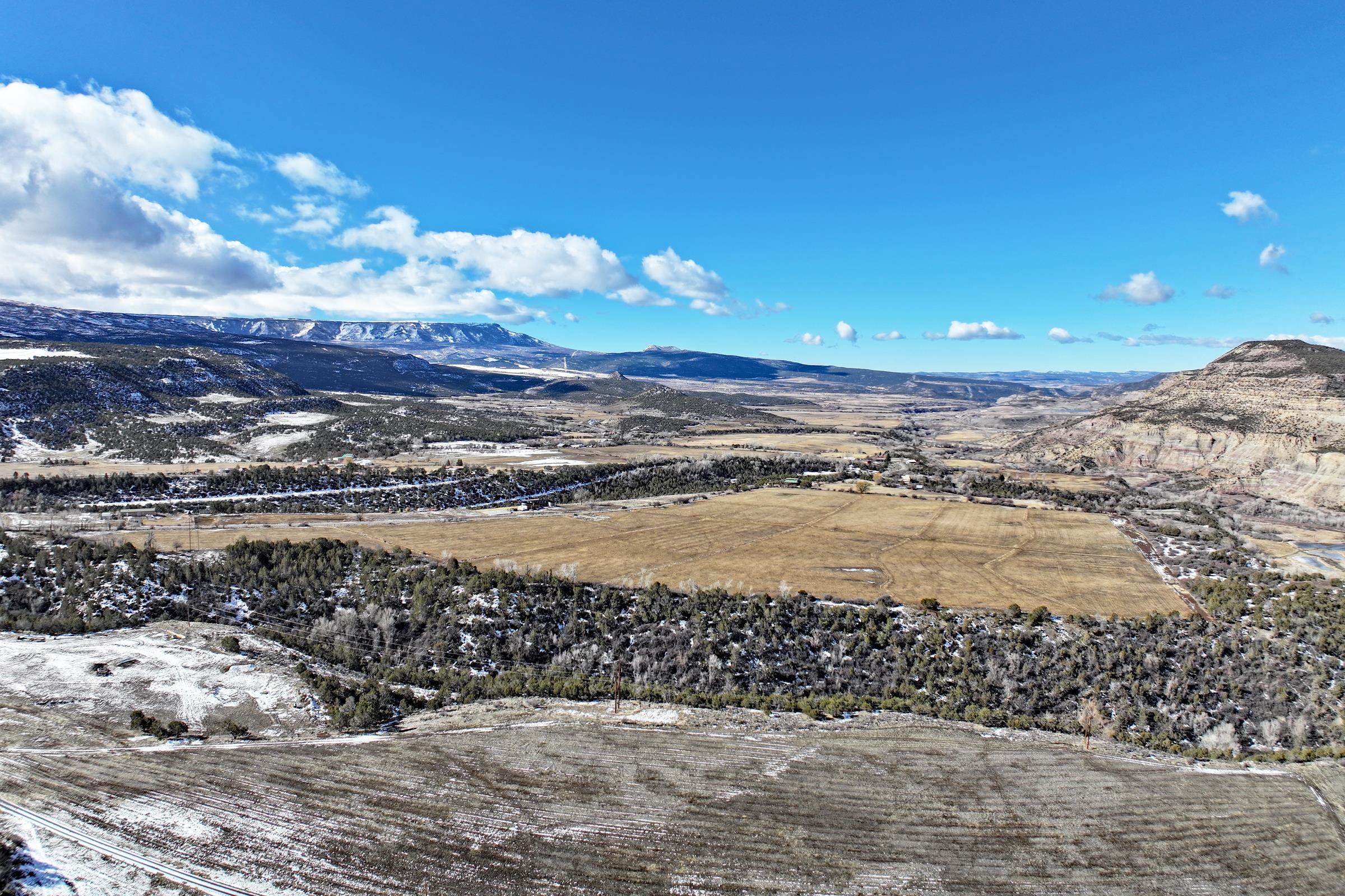 12482 54 54 7/10 Road Molina, CO 81646 - Photo 3 of 17 a view of a lake with a beach