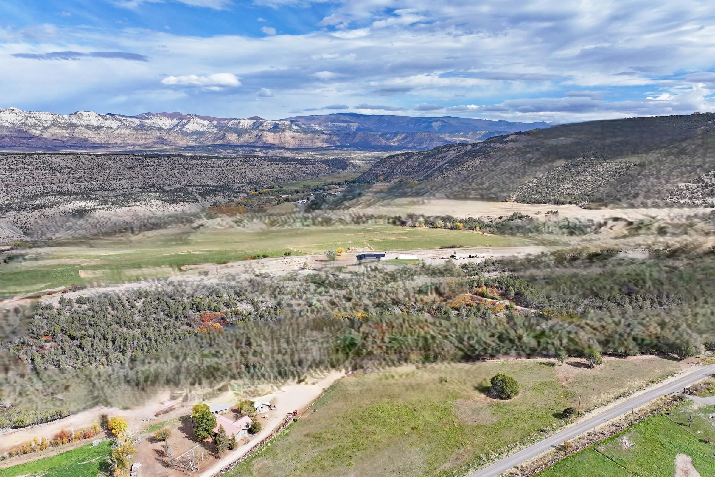 12482 54 54 7/10 Road Molina, CO 81646 - Photo 3 of 23 a view of a lake with a mountain
