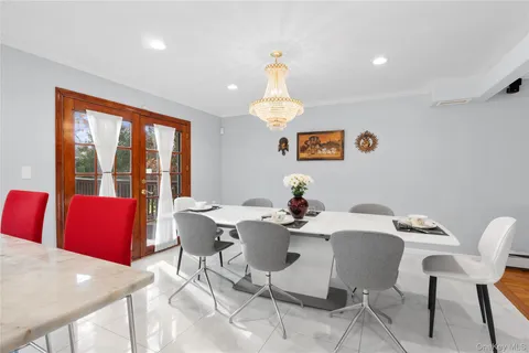 a view of a dining room with furniture window and outside view