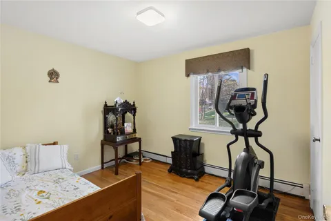 a bedroom with a bed and a book shelf