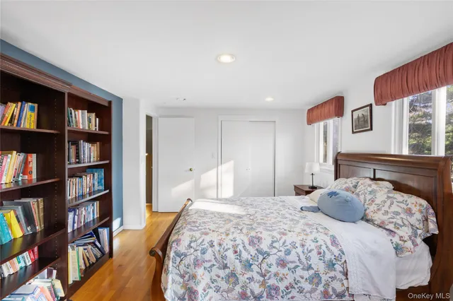 a bed room with a bed and a chair