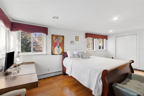 a bathroom with a sink toilet vanity and shower