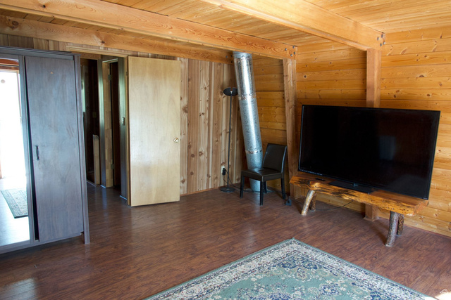140 East Rim Road Duck Creek Village, UT 84762 - Photo 32 of 45 Unfurnished room with a wood ceiling with exposed beams, dark wood-style flooring, and wood walls