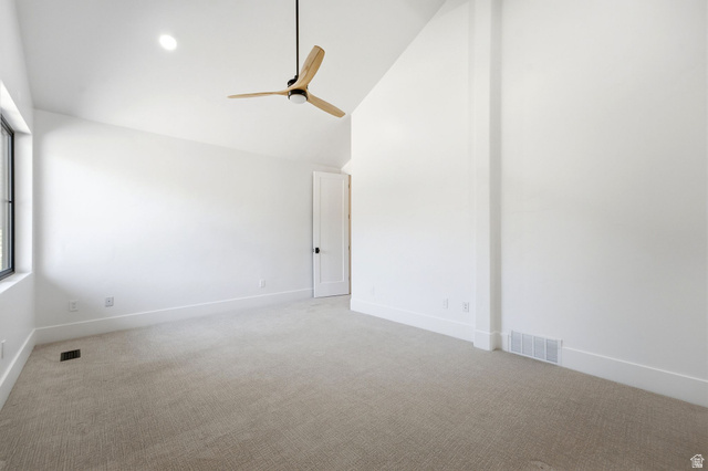 3027 Homestead Road Park City, UT 84098 - Photo 38 of 62 Spacious interior with vaulted ceilings, featuring neutral carpeting, white trim, a modern ceiling fan, and a single window with black framing