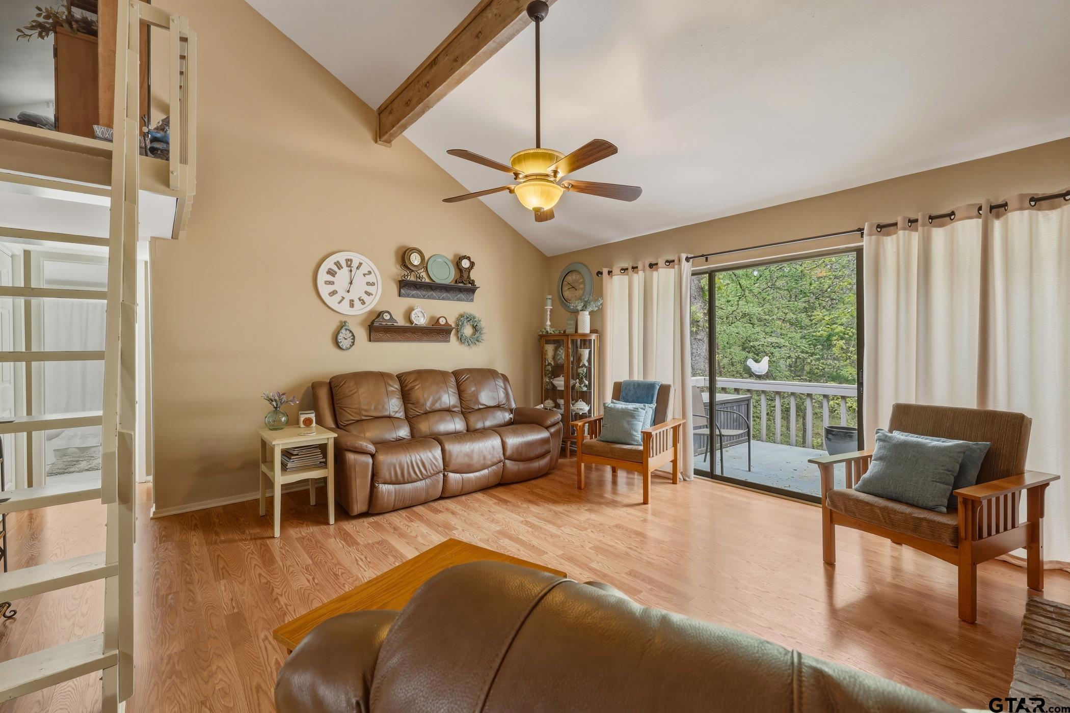 178 Holly Hill Circle Holly Lake Ranch, TX 75765 - Photo 11 of 18 a living room with furniture and a window