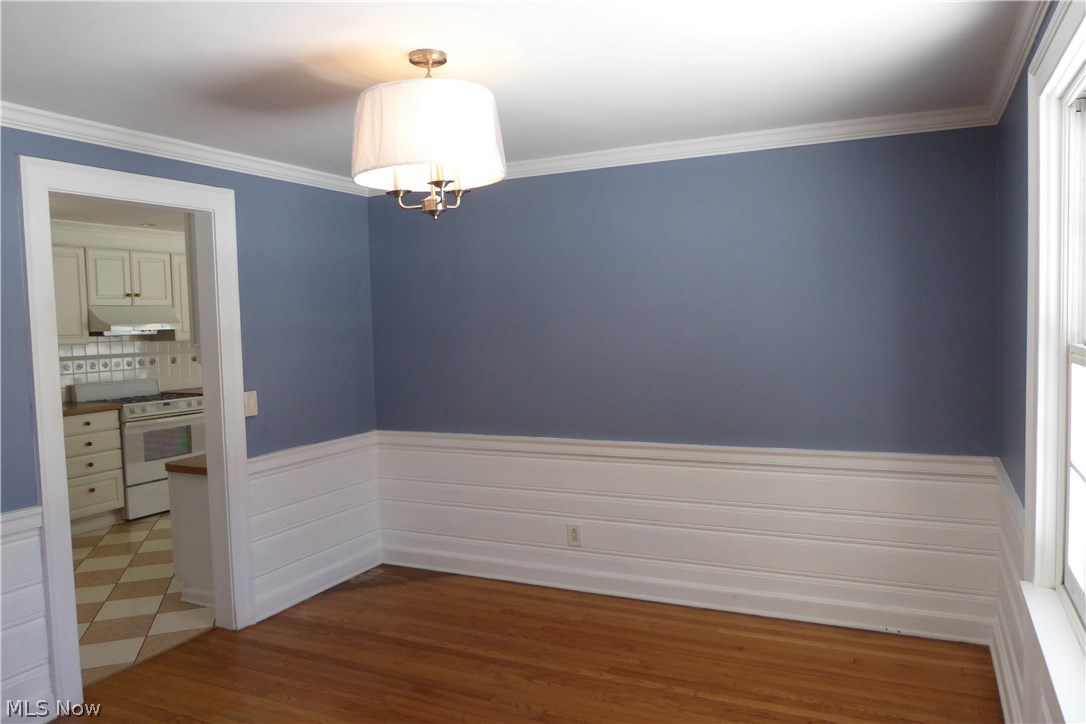 15421 Hemlock Point Road Chagrin Falls, OH 44022 - Photo 7 of 29 Formal Dining ... Wainscoting, Crown Molding, New Light Fixture, Hardwood Flooring!