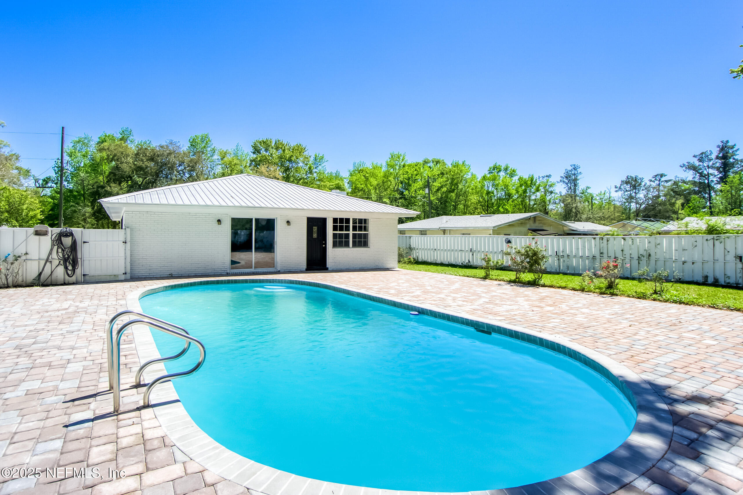 11084 Ker Del Road Jacksonville, FL 32218 - Photo 1 of 26 a swimming pool with outdoor seating and yard
