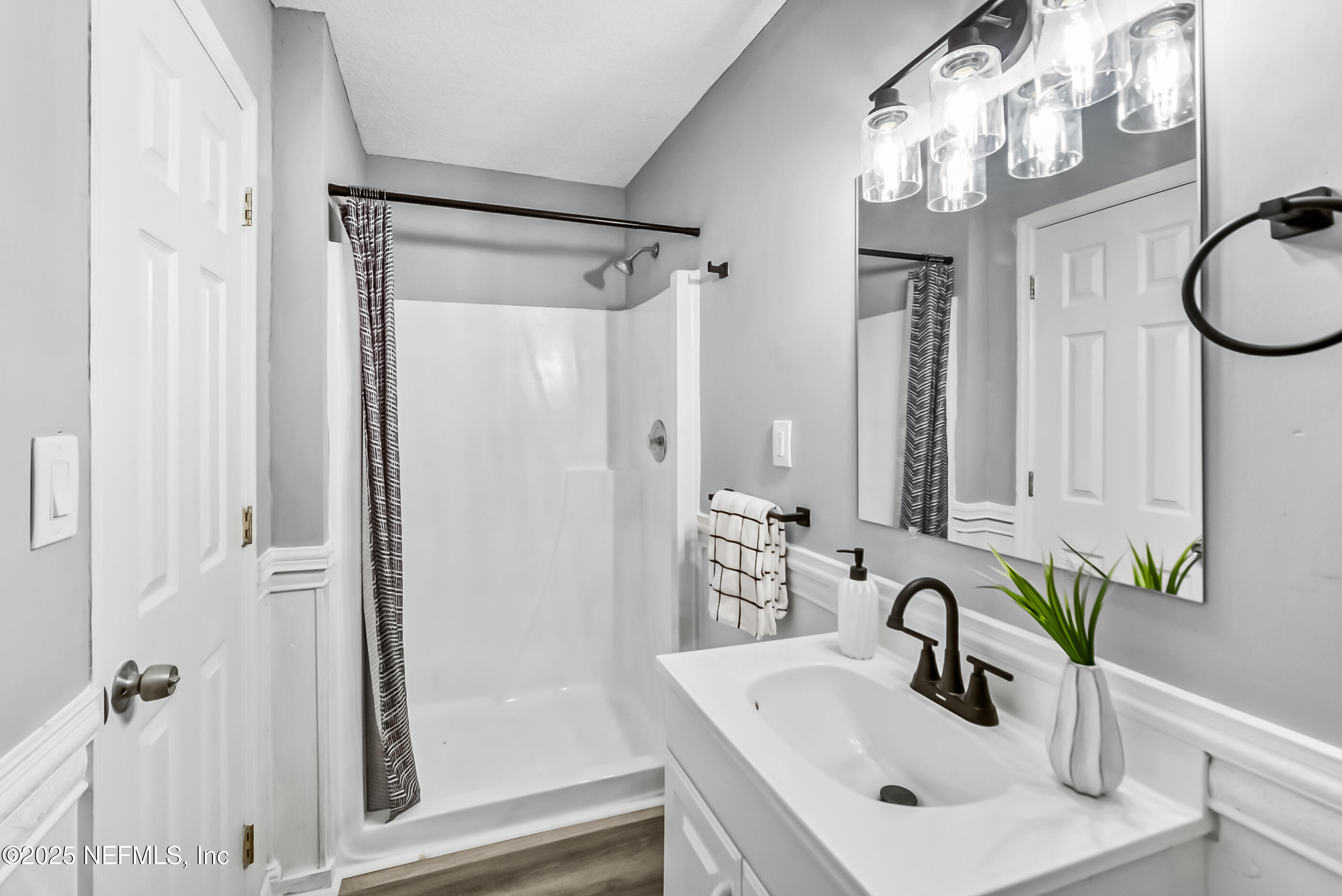 11084 Ker Del Road Jacksonville, FL 32218 - Photo 14 of 26 a bathroom with a sink and a mirror