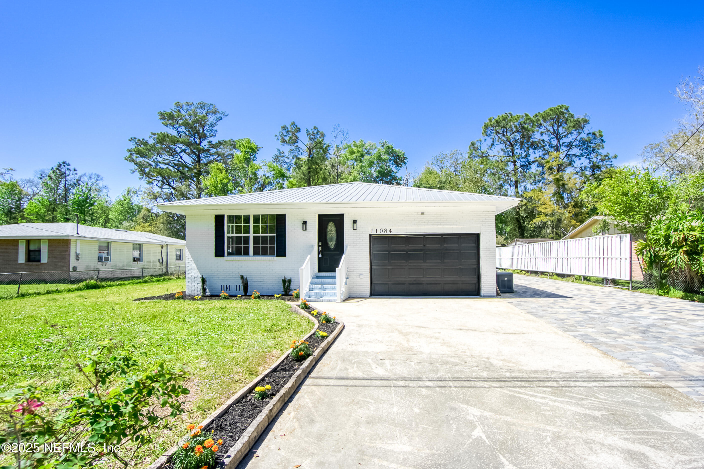 11084 Ker Del Road Jacksonville, FL 32218 - Photo 2 of 26 a view of a house with a yard and a large tree